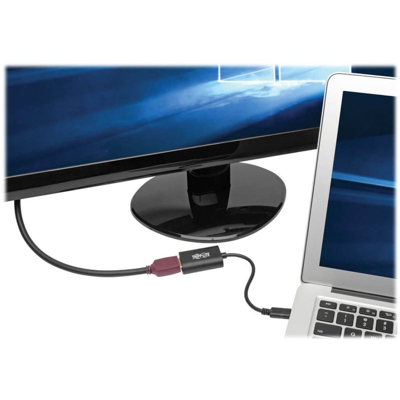 Adapter connected between laptop and monitor showing display setup