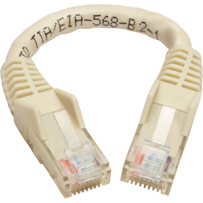 Curved view of white Cat6 patch cable showing printed identification markings