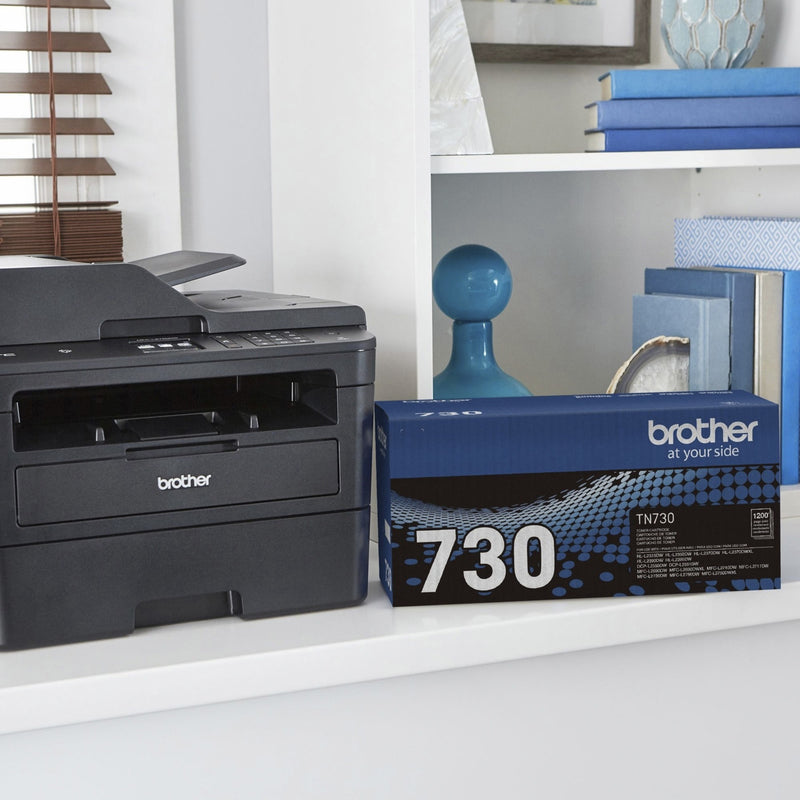 Brother printer and TN-730 toner cartridge displayed in modern office setting