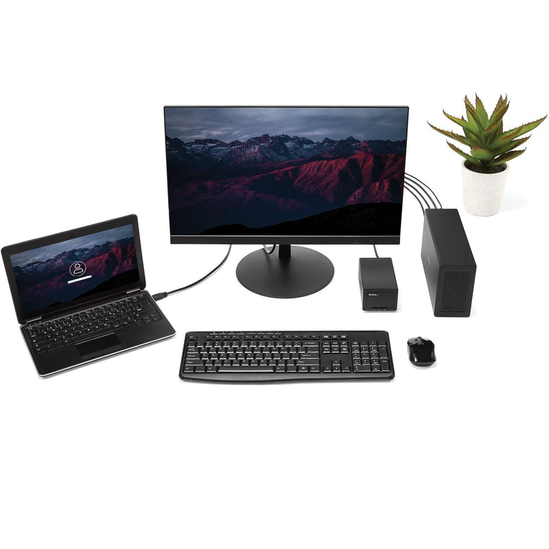 Complete workstation setup showing TB31PCIEX16 connected to laptop with external monitor and peripherals