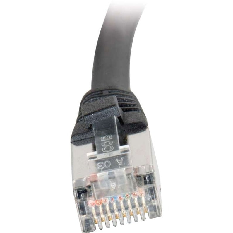 Macro shot of transparent RJ-45 connector showing internal pin configuration