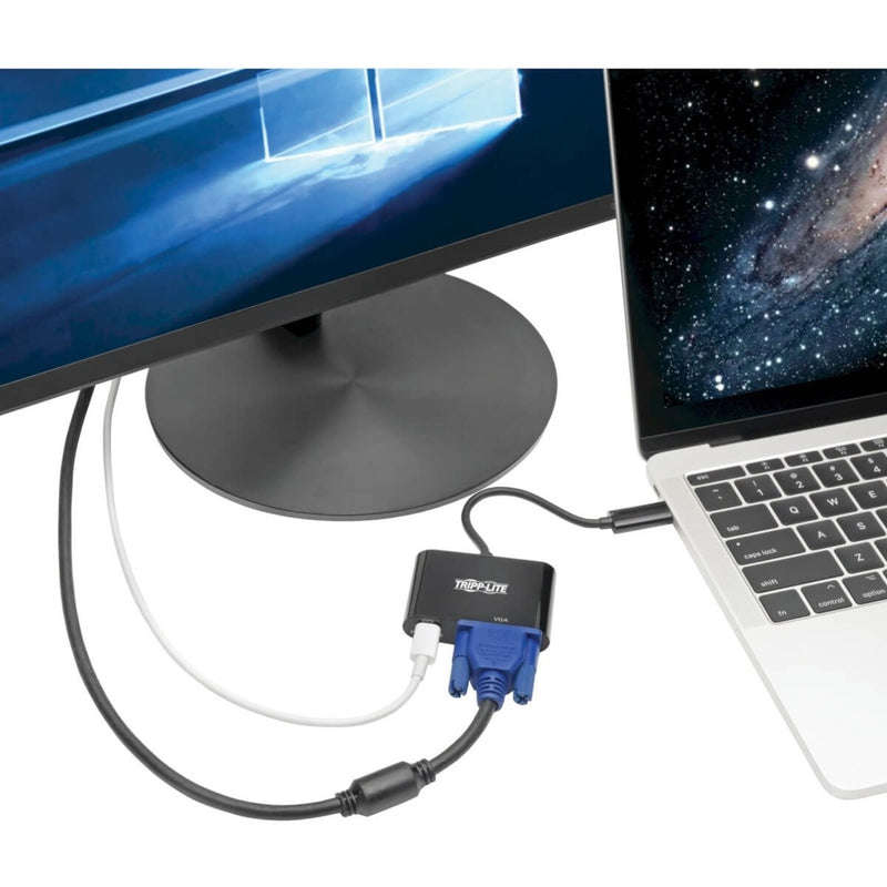 Tripp Lite USB-C to VGA adapter connected between laptop and monitor in use