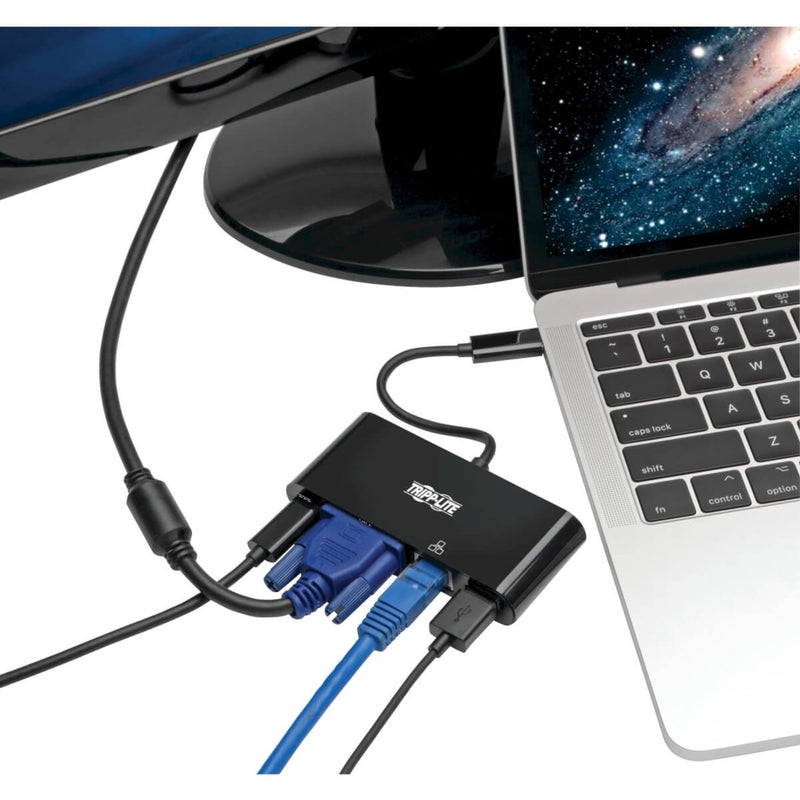 Tripp Lite docking station connected to a laptop with multiple cables attached