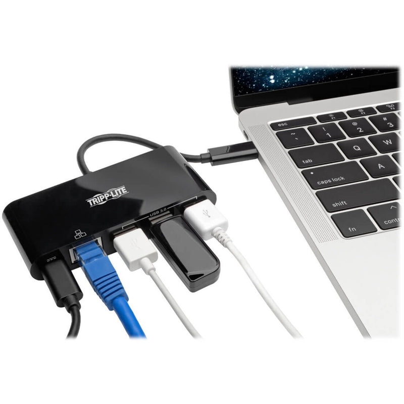 Tripp Lite USB-C hub connected to a laptop with multiple devices plugged in