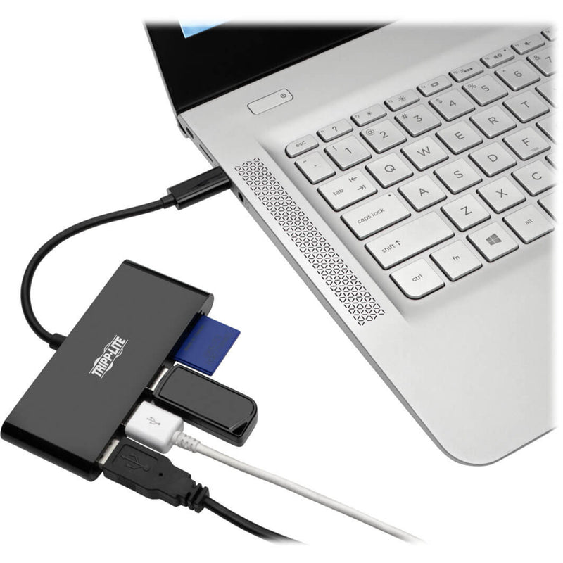 Tripp Lite USB-C hub connected to a laptop with multiple devices attached