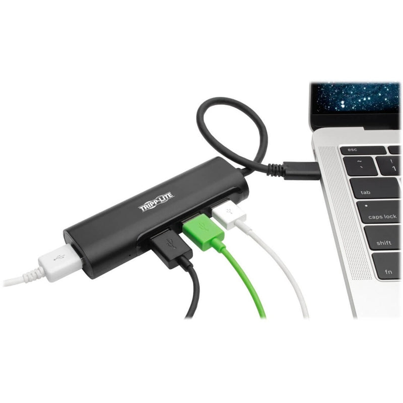 Tripp Lite USB hub connected to laptop with multiple USB devices plugged in showing active use