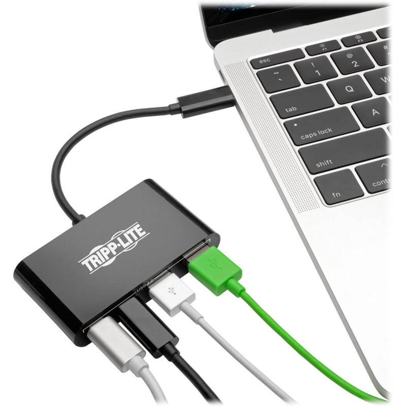 Tripp Lite USB hub connected to a laptop with multiple USB devices plugged in