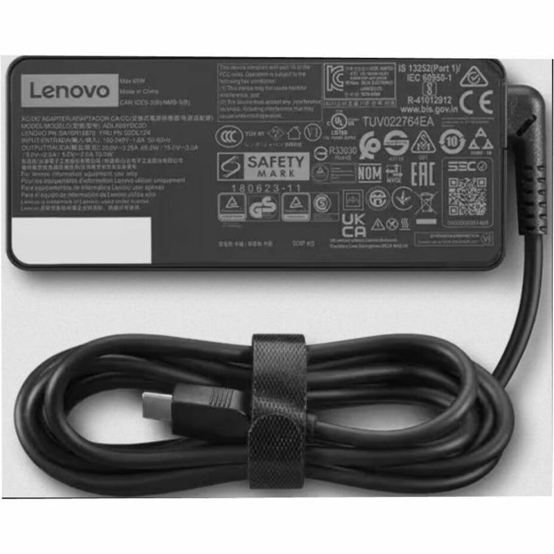 Close-up of Lenovo AC adapter safety certifications and organized cable with management strap