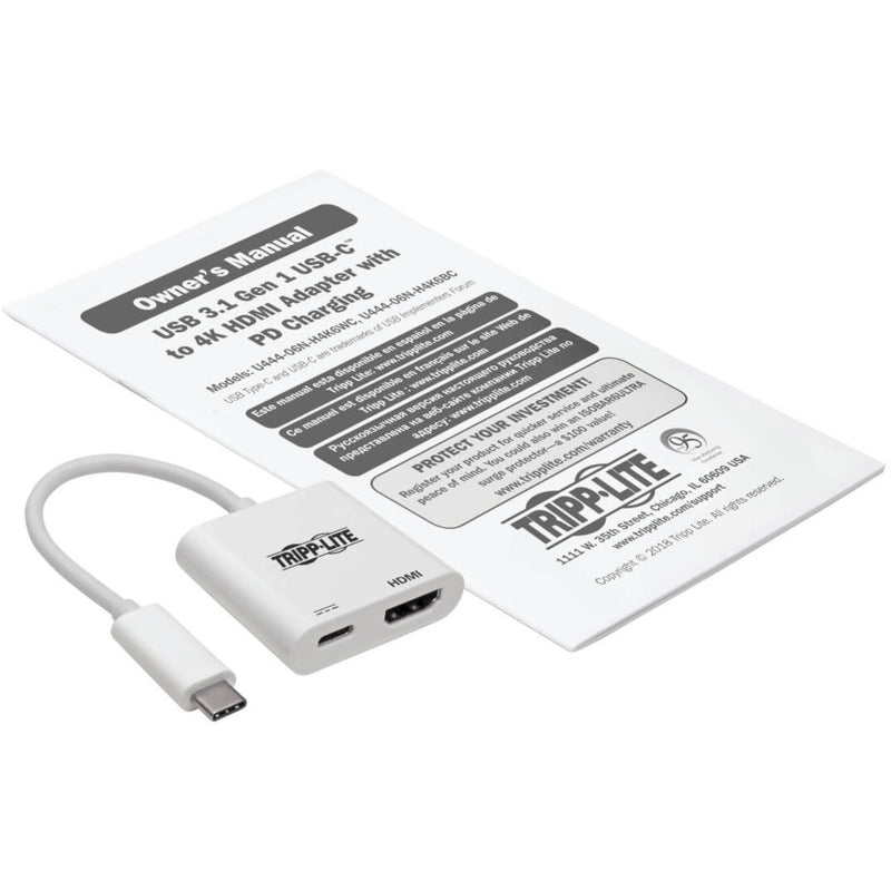 Tripp Lite adapter shown with included user manual and documentation