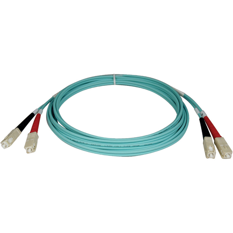 Tripp Lite N806-10M aqua-colored fiber optic patch cable with SC connectors showing 32.8 foot length coiled configuration