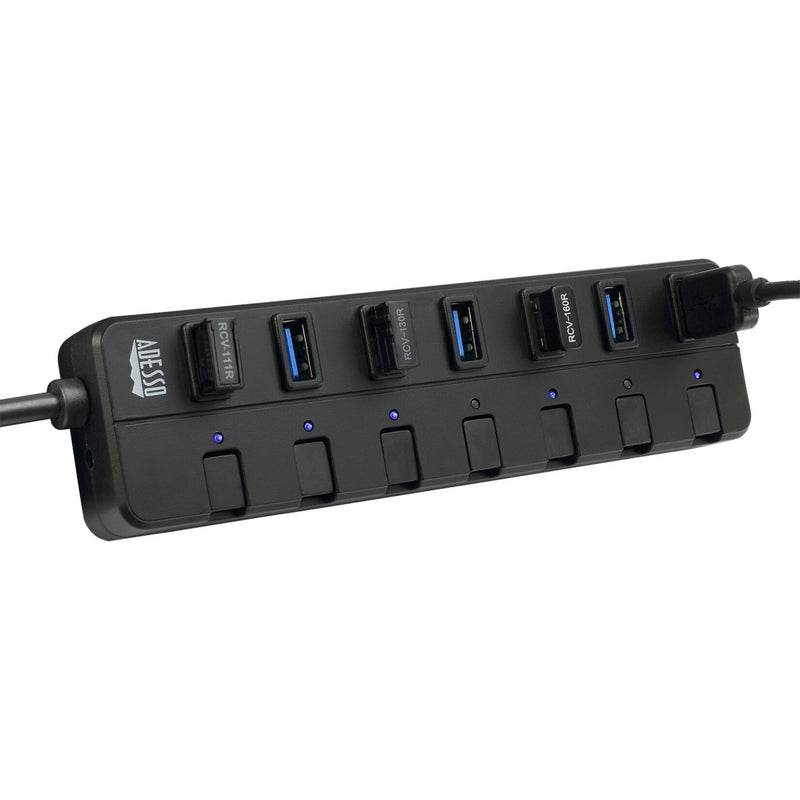 Close-up of USB hub showing illuminated LED indicators and power switches