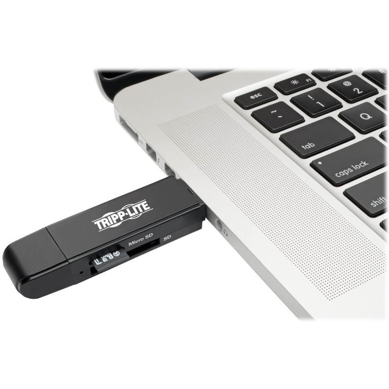 Tripp Lite card reader connected to a laptop USB port showing practical usage