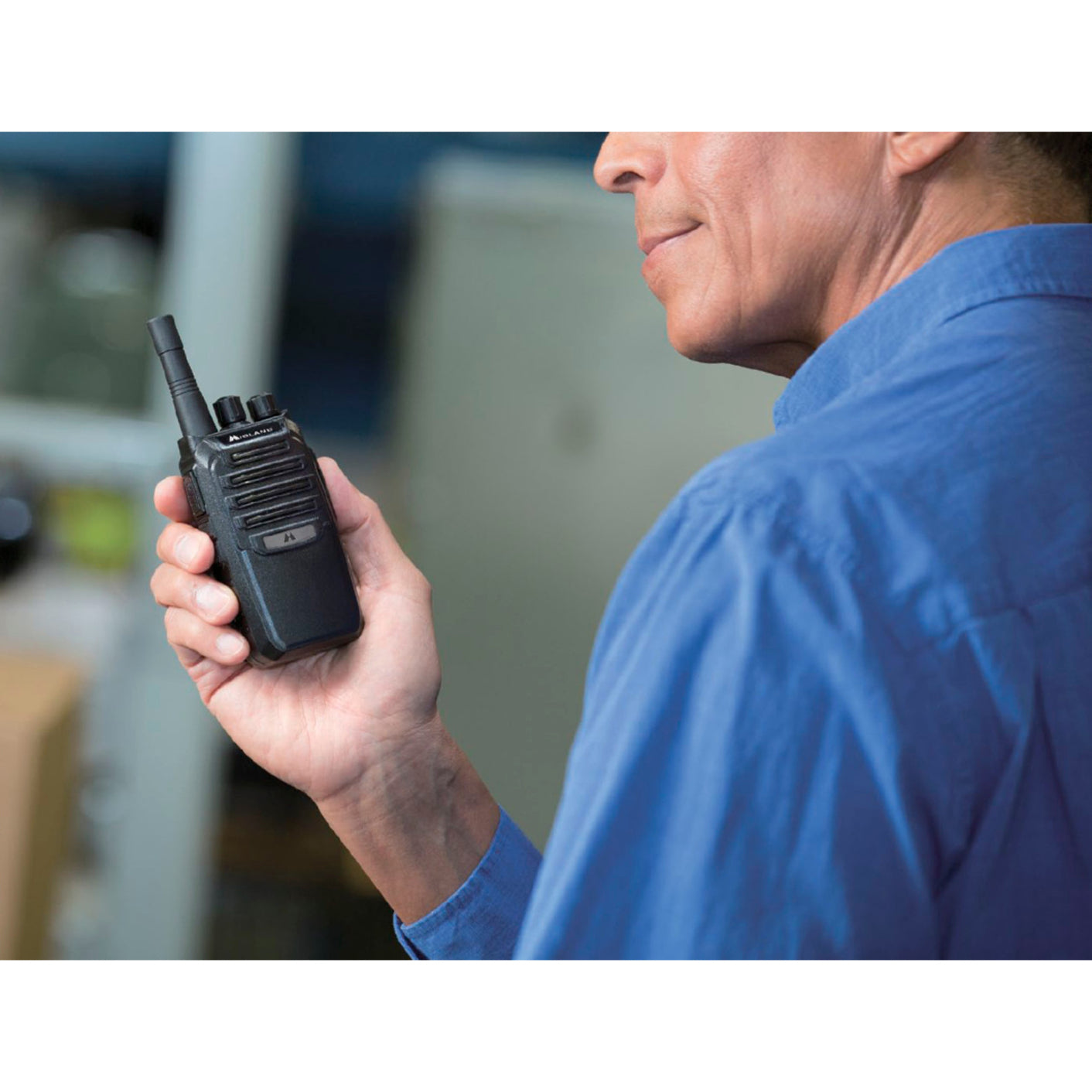 Industrial worker using Midland BR200 radio in workplace setting-alternate-image6