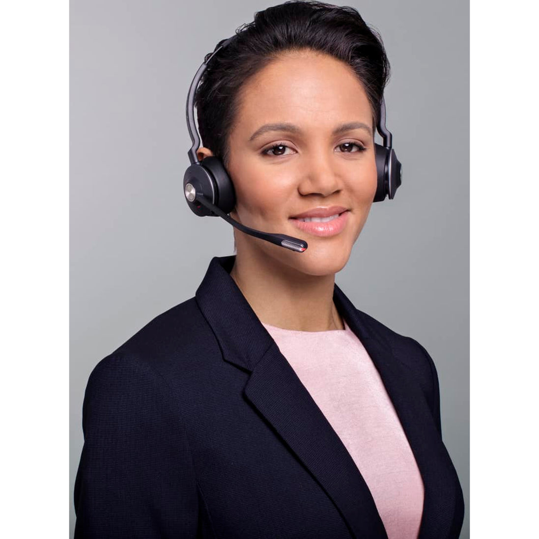 Professional demonstrating Jabra Engage 65 headset in business setting-alternate-image9