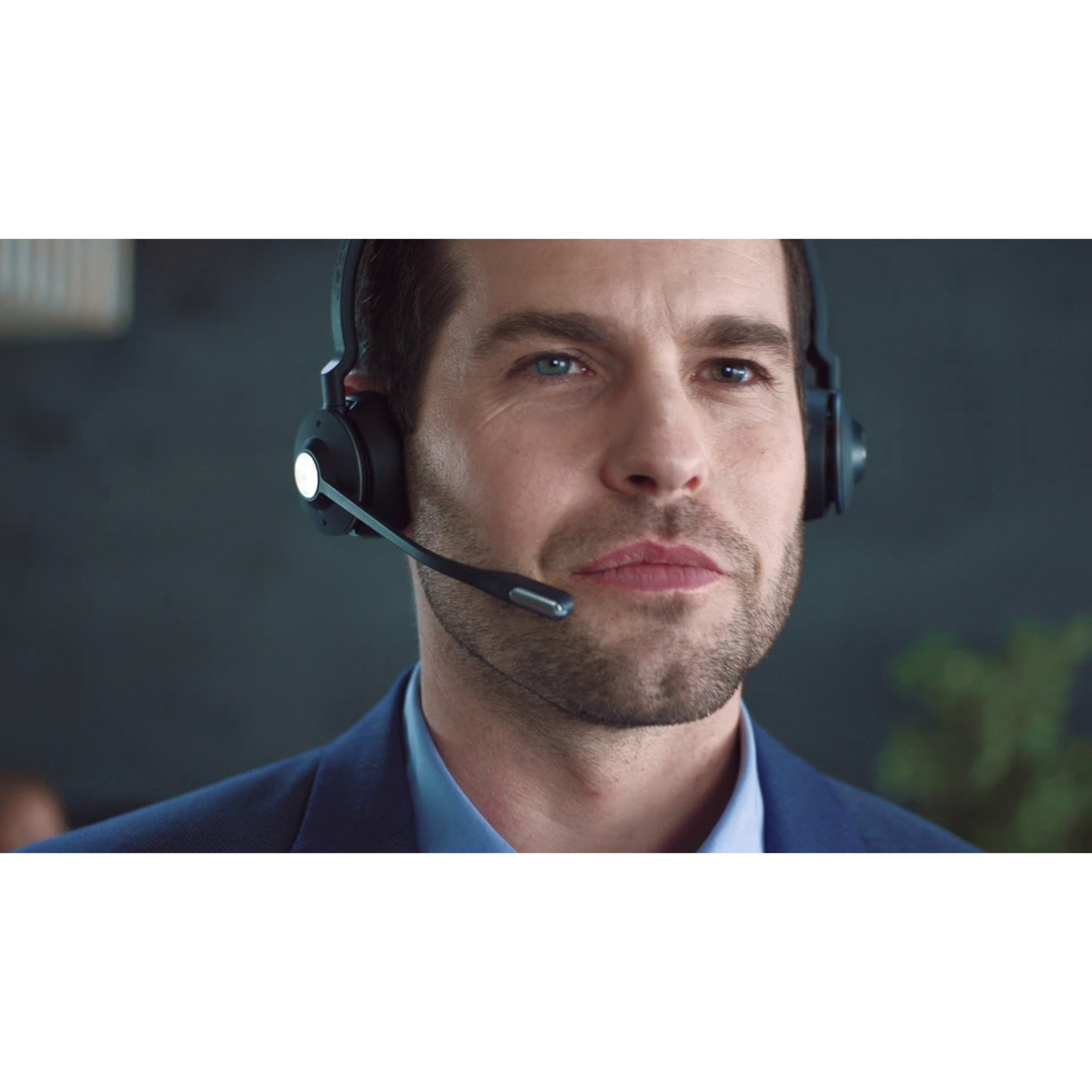 Professional wearing Jabra Engage 65 headset in office setting-alternate-image8