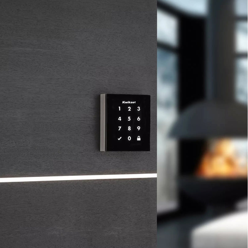 Kwikset Obsidian smart lock installed in modern interior setting with ambient lighting