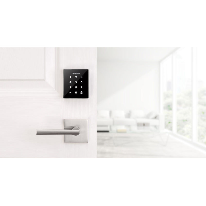 Kwikset Obsidian smart lock installed on white door in modern home setting