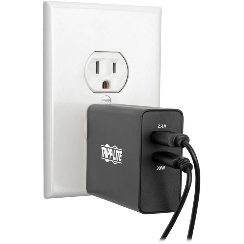 Tripp Lite charger mounted in wall outlet showing practical usage