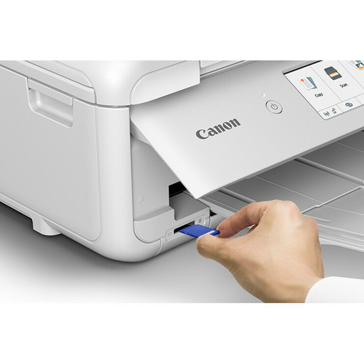 Close-up of hand loading paper into Canon PIXMA TS9521C printer-alternate-image7