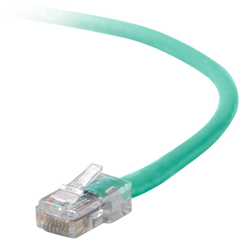 Close-up view of Belkin Cat 5e green network cable with transparent snagless RJ45 connector