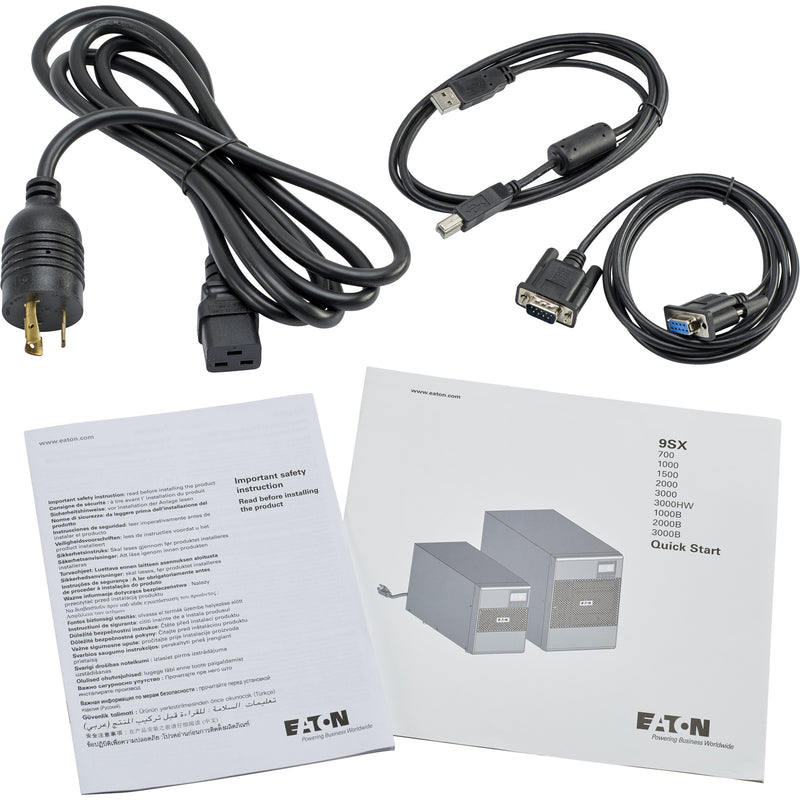 Layout of UPS connectivity cables and documentation including power cord, USB, and serial cables