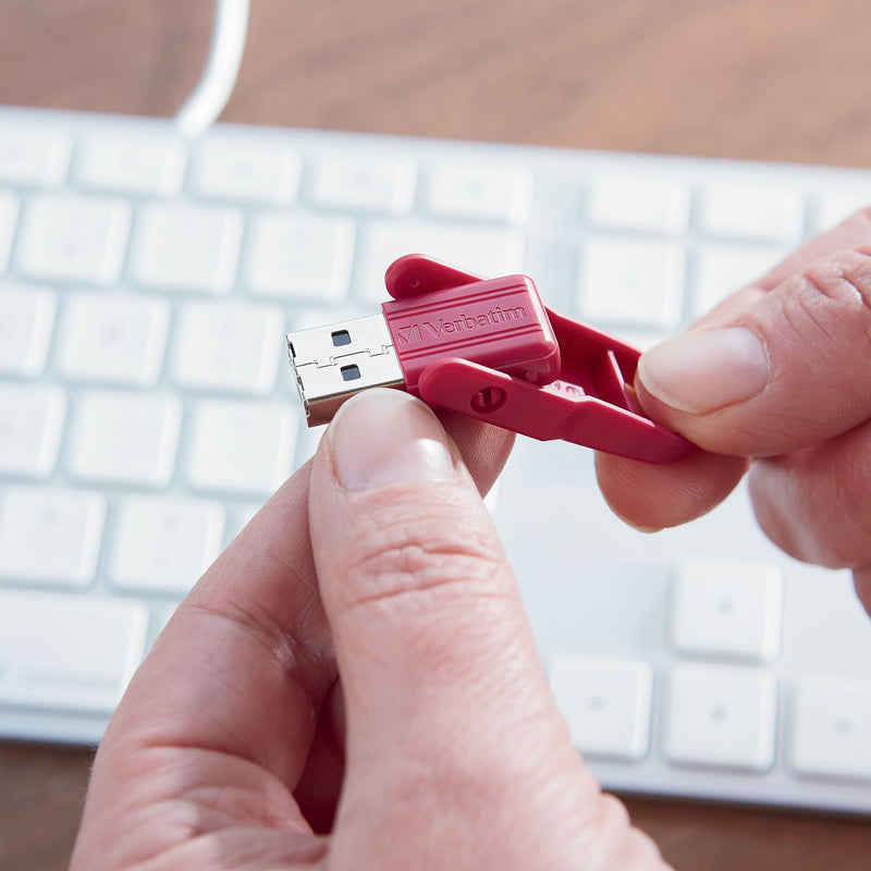 Hands demonstrating Store 'n' Flip USB drive operation