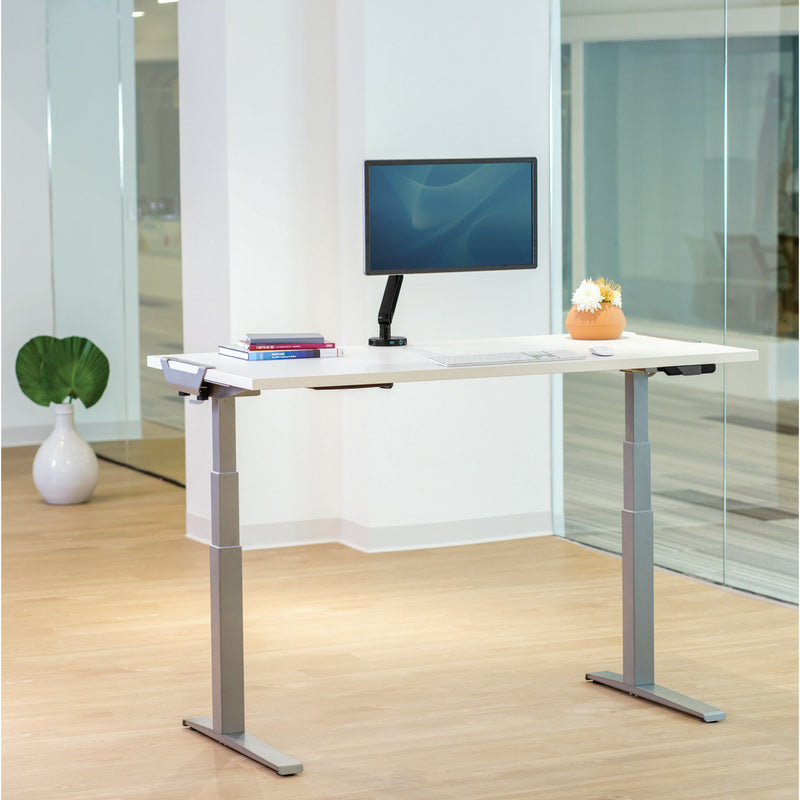 Levado desk with mounted monitor and organized desktop accessories in modern office setting