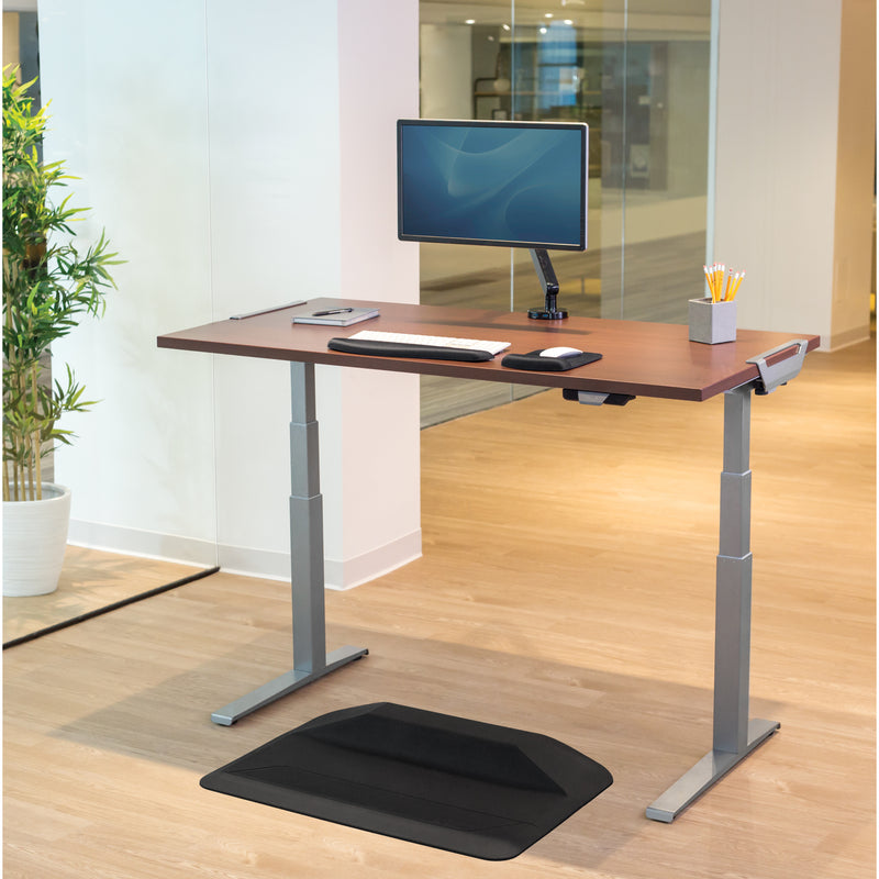 Fully equipped Levado standing desk with monitor, keyboard, and anti-fatigue mat