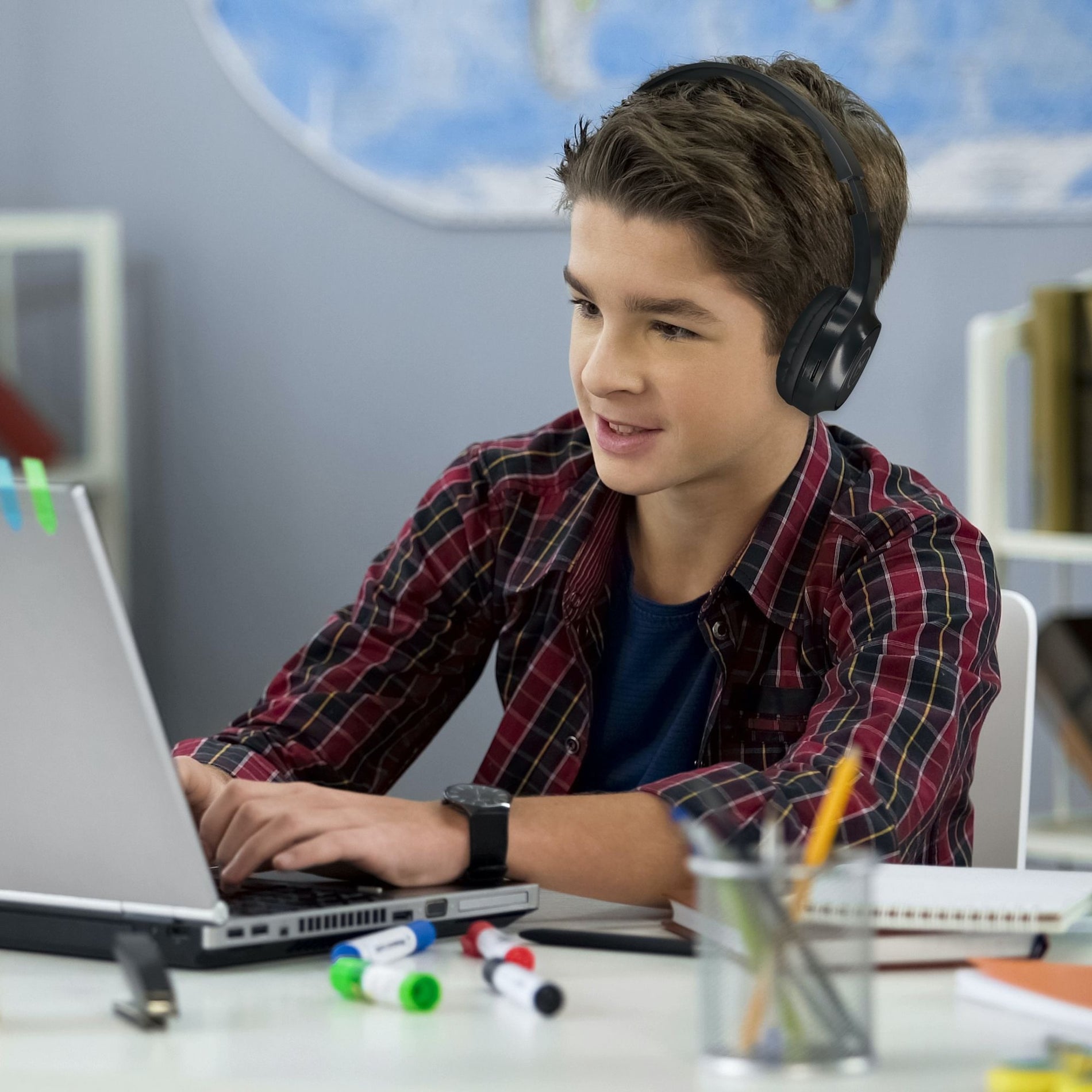 Student using Morpheus 360 headphones during online learning session with laptop-alternate-image9