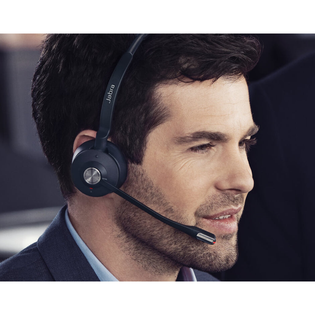 Professional wearing the Jabra Engage 65 Mono headset in an office setting-alternate-image9