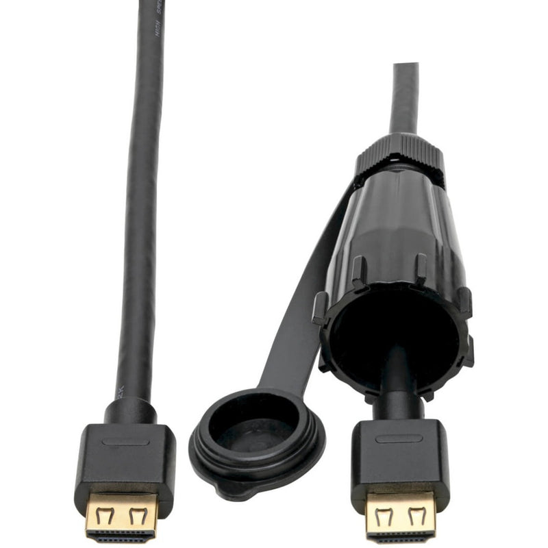 Close-up of IP68 waterproof HDMI connector and protective cap on industrial-grade cable