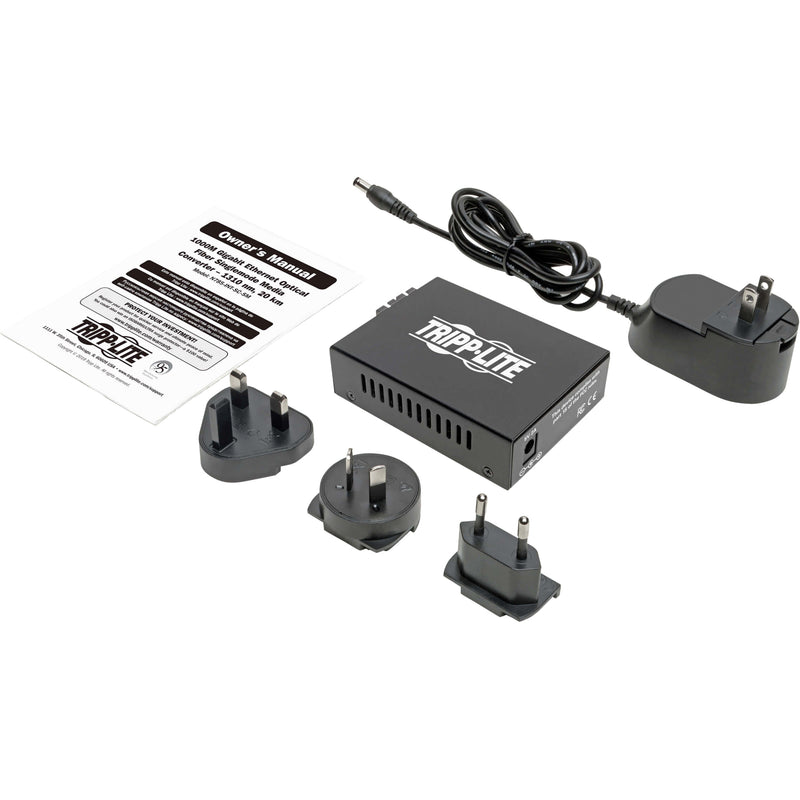 Complete package contents including media converter, international power adapters, and documentation