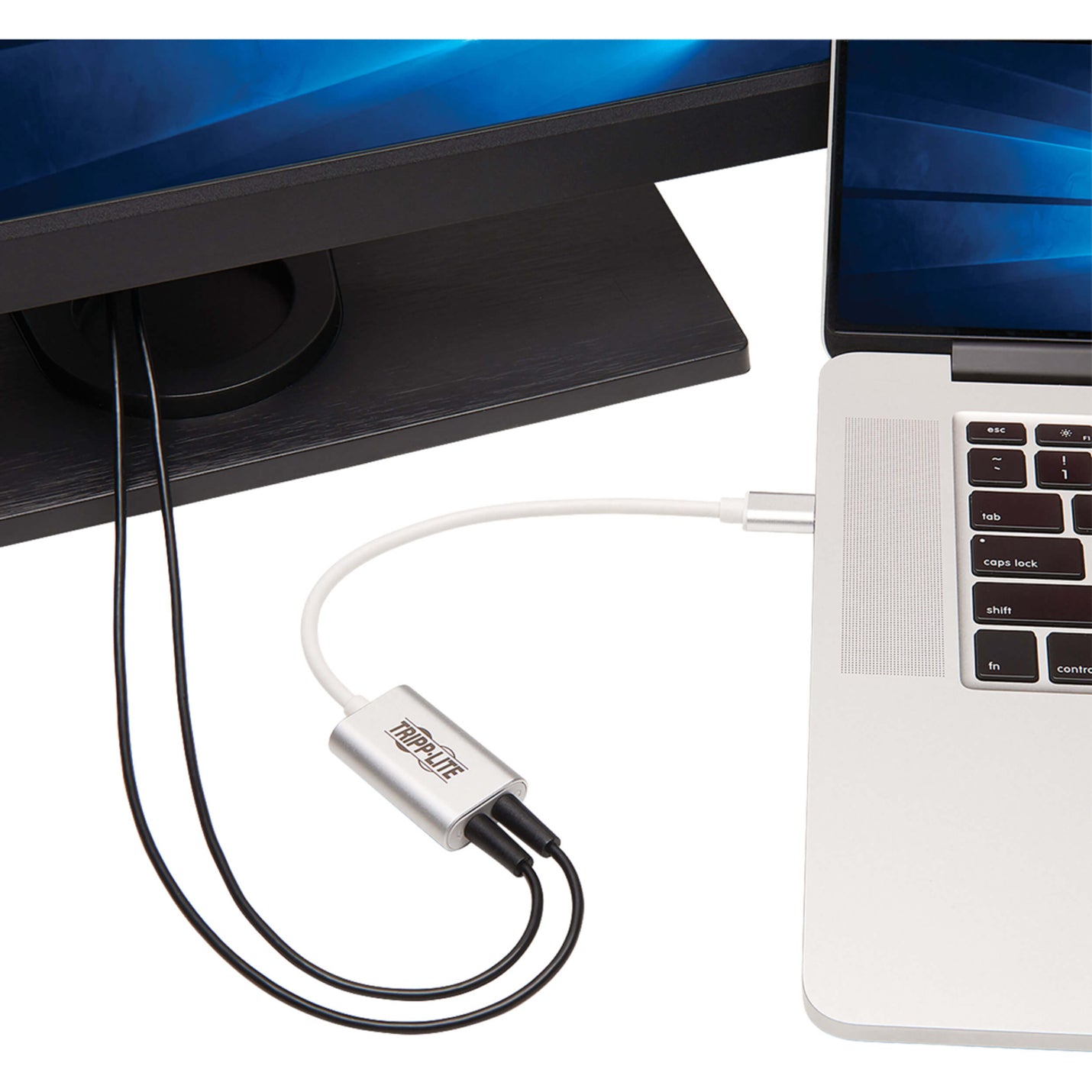 Tripp Lite audio adapter connected to a laptop USB-C port showing real-world usage-alternate-image2