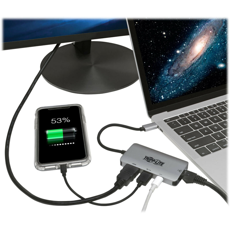 Tripp Lite docking station in use with laptop, smartphone charging, and external monitor