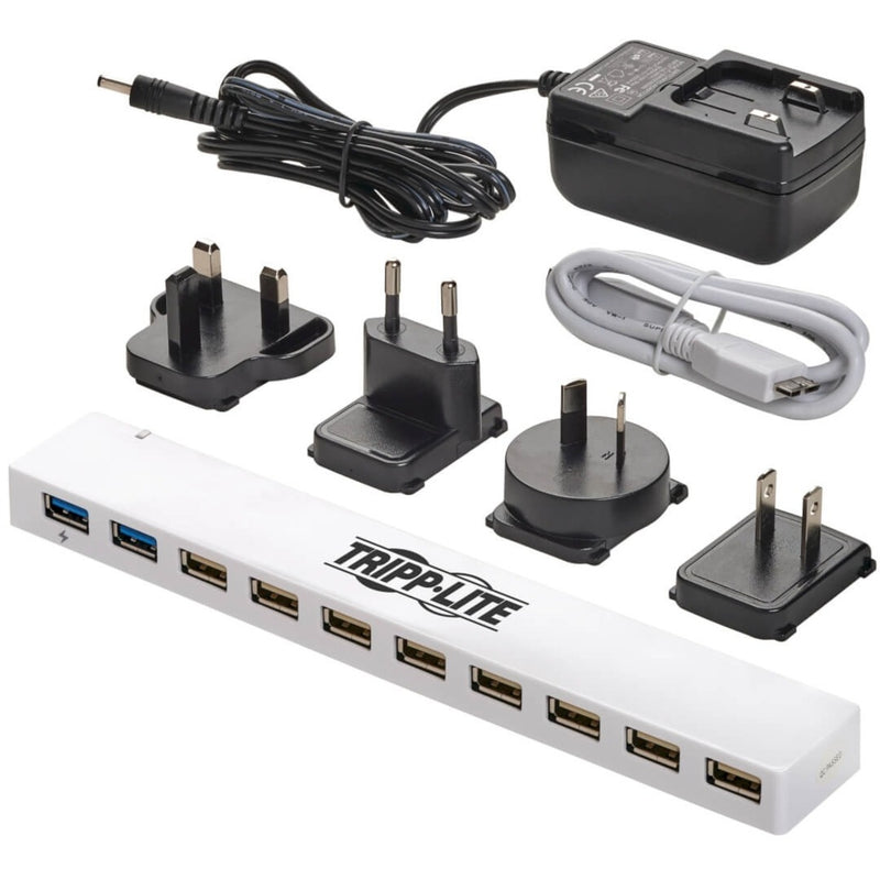 Complete package contents of Tripp Lite USB hub including international power adapters and cables