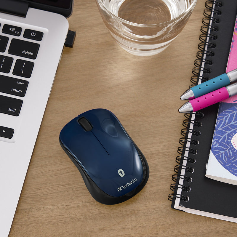 Verbatim Bluetooth mouse in a workspace setting with laptop and accessories