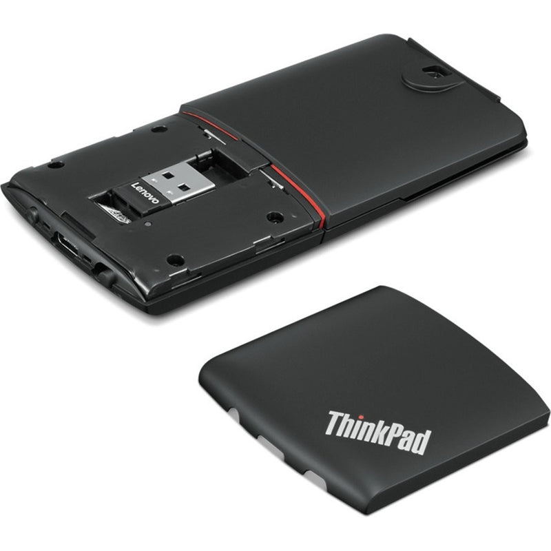 Internal view of ThinkPad X1 Presenter Mouse showing USB receiver storage and battery compartment