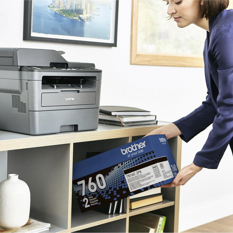 Person installing Brother TN760 toner cartridge in office printer