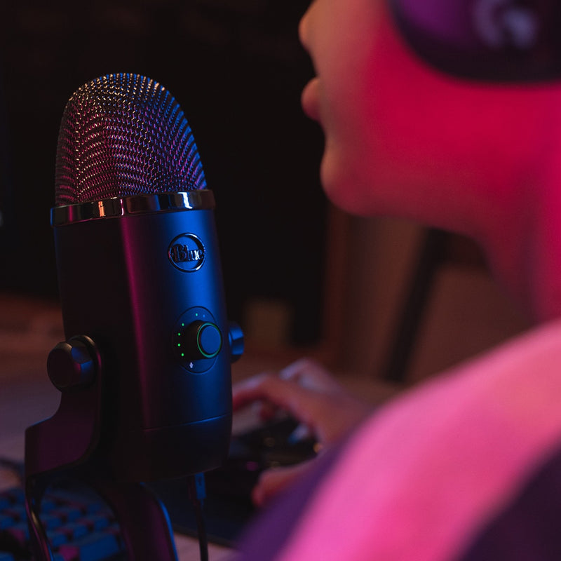 Blue Yeti X microphone illuminated with RGB lighting in dark setting