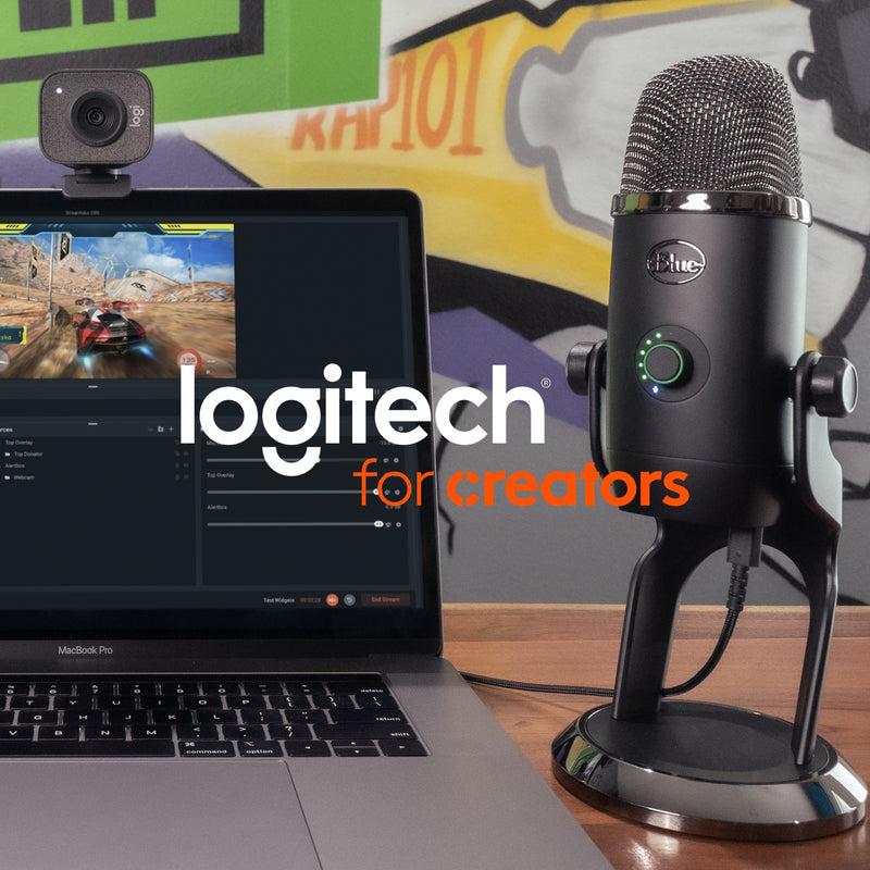 Blue Yeti microphone with Logitech webcam and gaming laptop setup