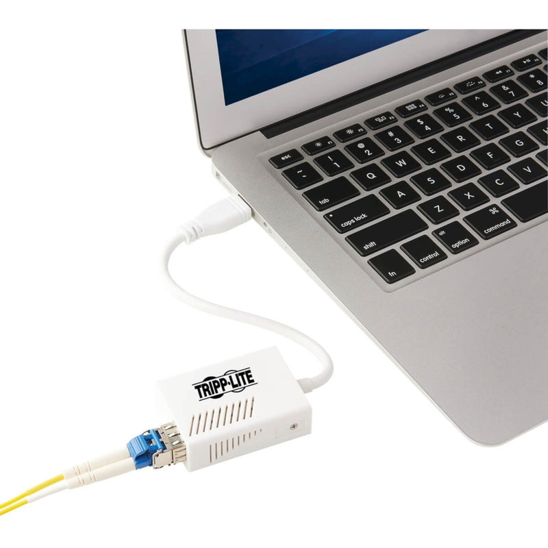 Tripp Lite fiber adapter connected to laptop USB port showing ease of installation