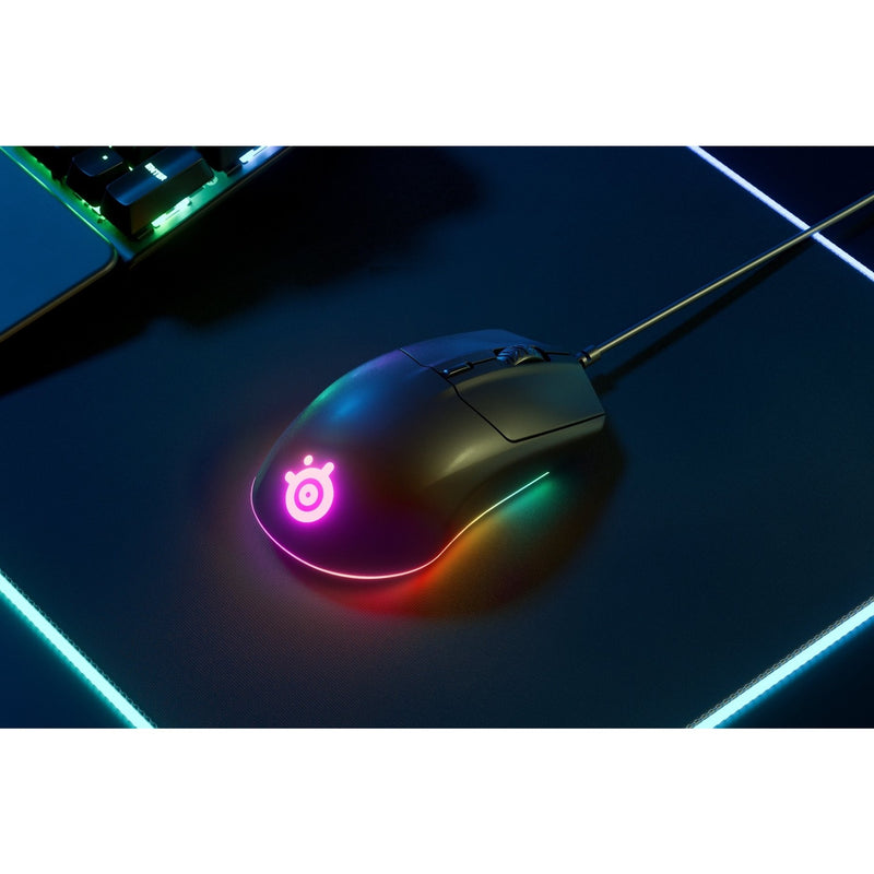 Atmospheric shot of SteelSeries Rival 3 with RGB lighting in dark gaming setup