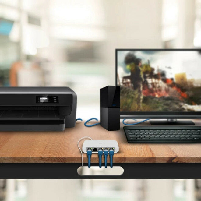 USW-Flex-Mini in real-world office setup connecting multiple devices