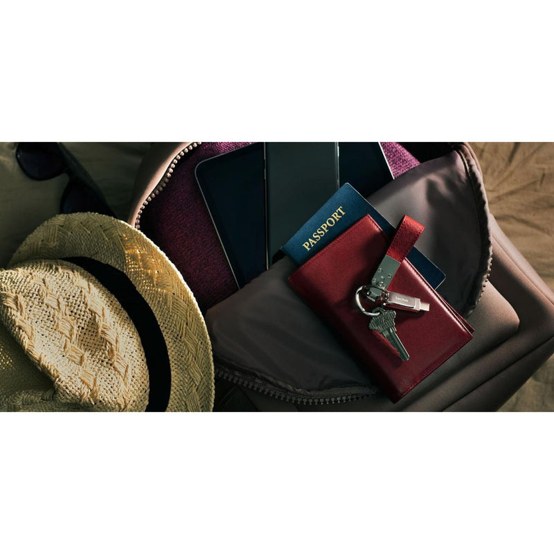 SanDisk Ultra Dual Drive Luxe shown with travel essentials including passport and accessories