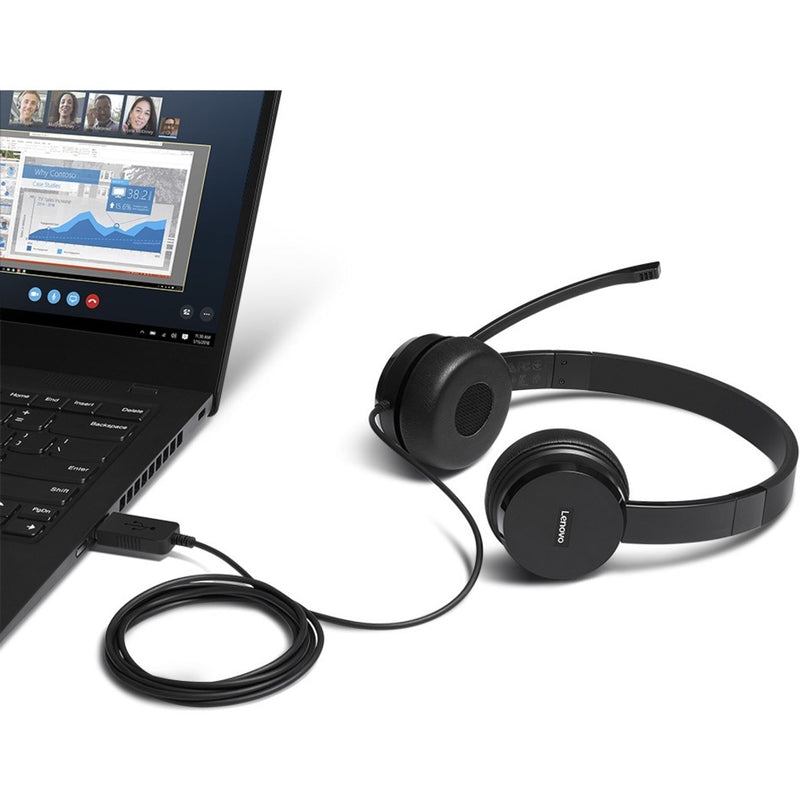 Lenovo 100 Headset connected to laptop during video conference call, showing practical usage scenario