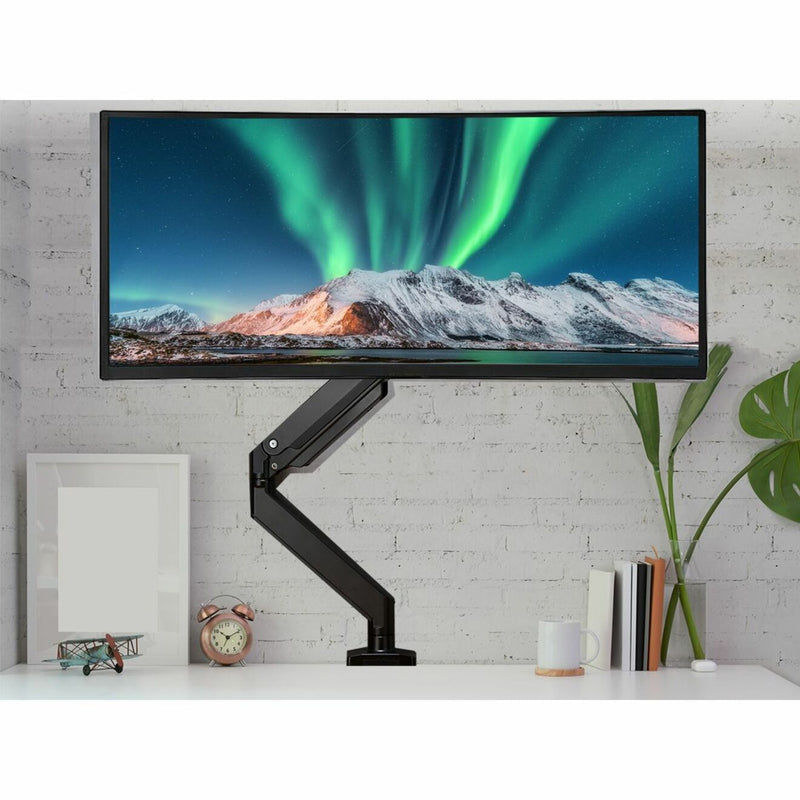 Monitor arm in modern office setting showing ergonomic positioning capabilities