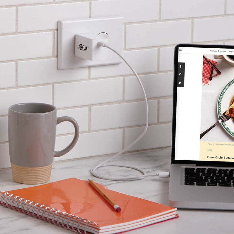 Tripp Lite charger in kitchen setting with laptop and coffee mug