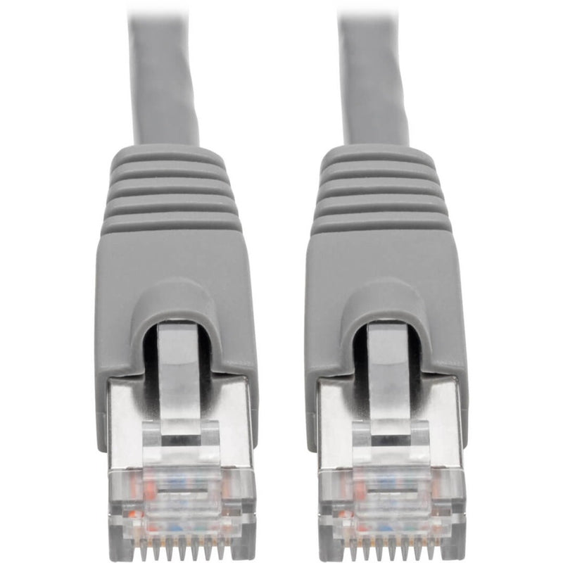 Close-up view of gold-plated RJ45 connectors with snagless boots on Cat6a cable