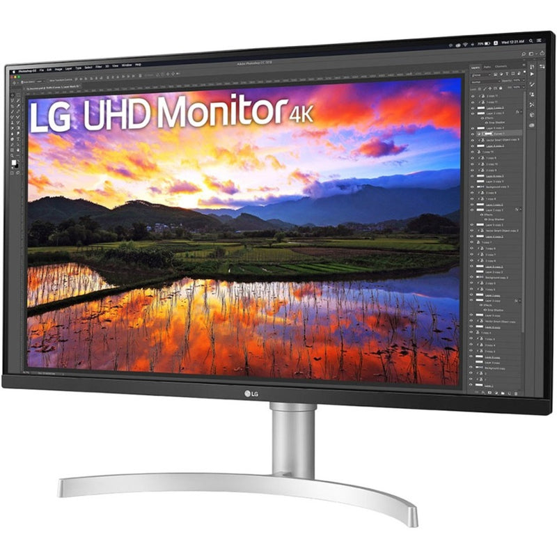 Front view of LG 32BN67U-B monitor displaying colorful 4K HDR landscape scene in Photoshop interface