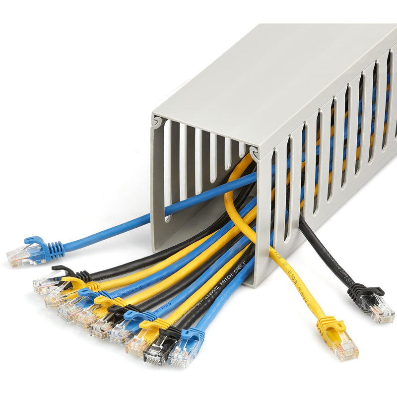 Cable raceway shown with multiple network cables properly organized and routed through slots